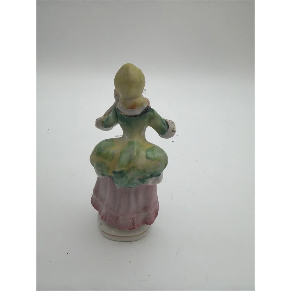vintage hand-painted porcelain colonial or Victorian lady figurine